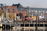 Providence & Worcester train NR-2 rolls along the Thames River in New London, CT behind Amtrak train 171, and his headed for Old Saybrook