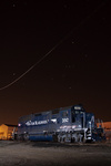 PanAm's MEC 350 sits in Plainville, CT quietly as a plane makes a turn overhead