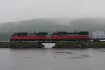 NR-2 rolls over the inlet to Mill Cove during a steady rain
