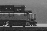 A P&W crew member rides in the trailing unit of NR-2 as the rain continues to fall in earnest