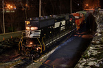 A Norfolk Southern GP40 idles with a Morristown & Erie caboose and boxcar in Morristown