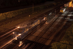 25V's power pulls away from their train to move to the next track and pick up the waiting cars