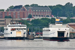 NR-2 is dwarfed by a pair of ferries in New London